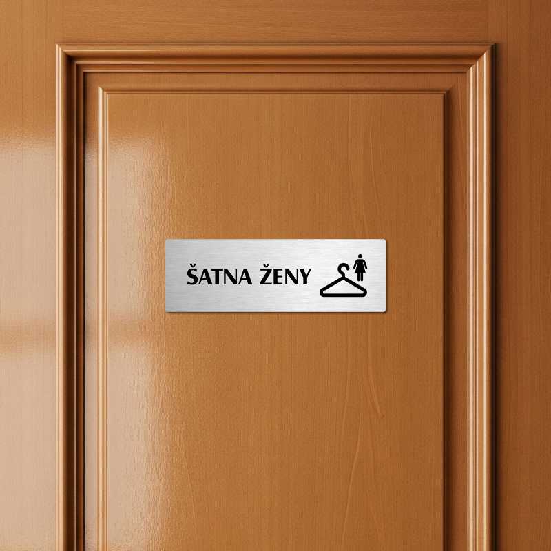 Šatna ženy, 240x79mm, zlatá popiska s ozdobou uprostřed